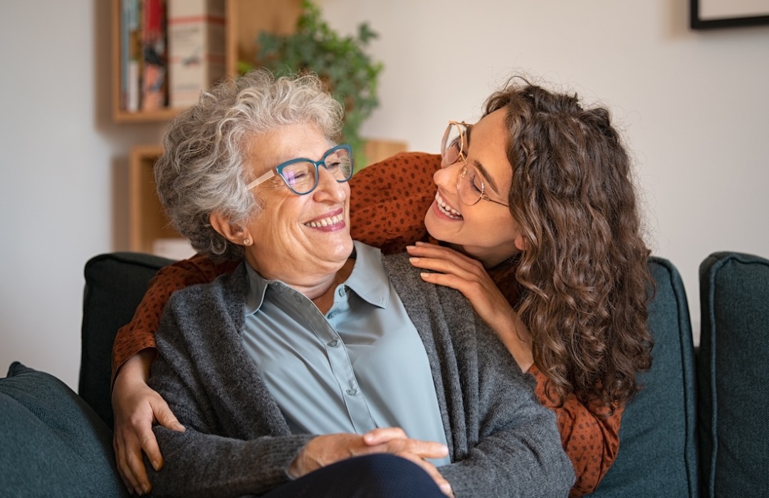 Women smiling Two women talking and smiling
