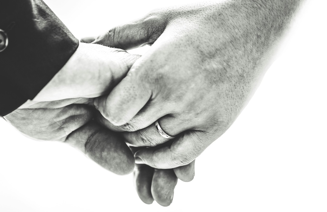 End-of-Life Conversations holding hands