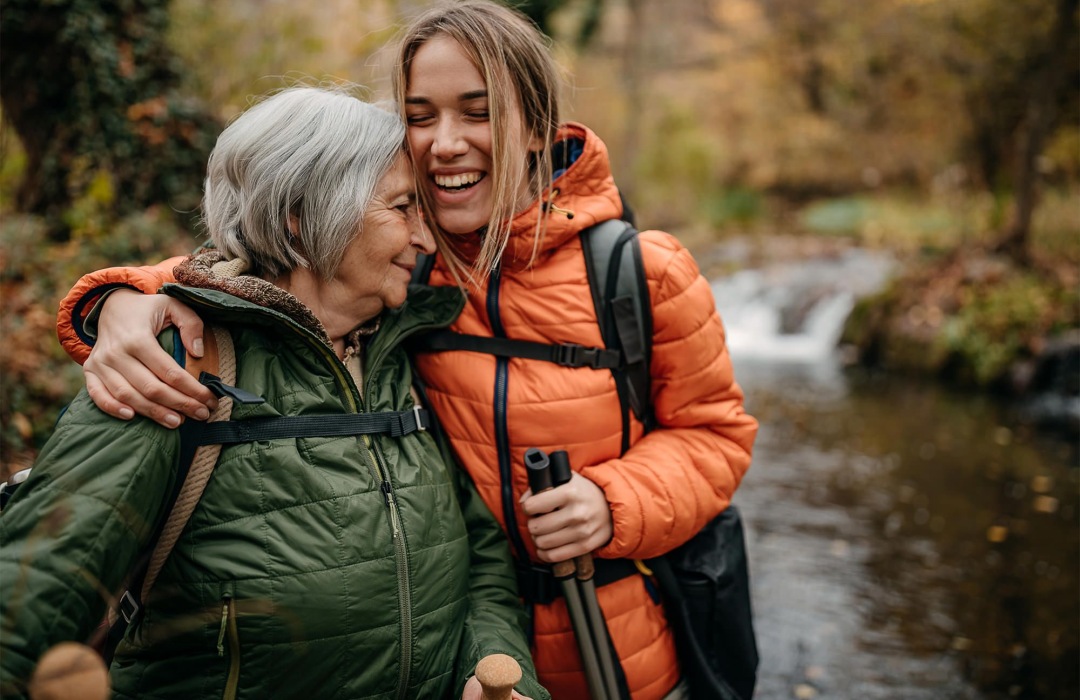 What Is a Caregiver Senior woman and her daughter hiking