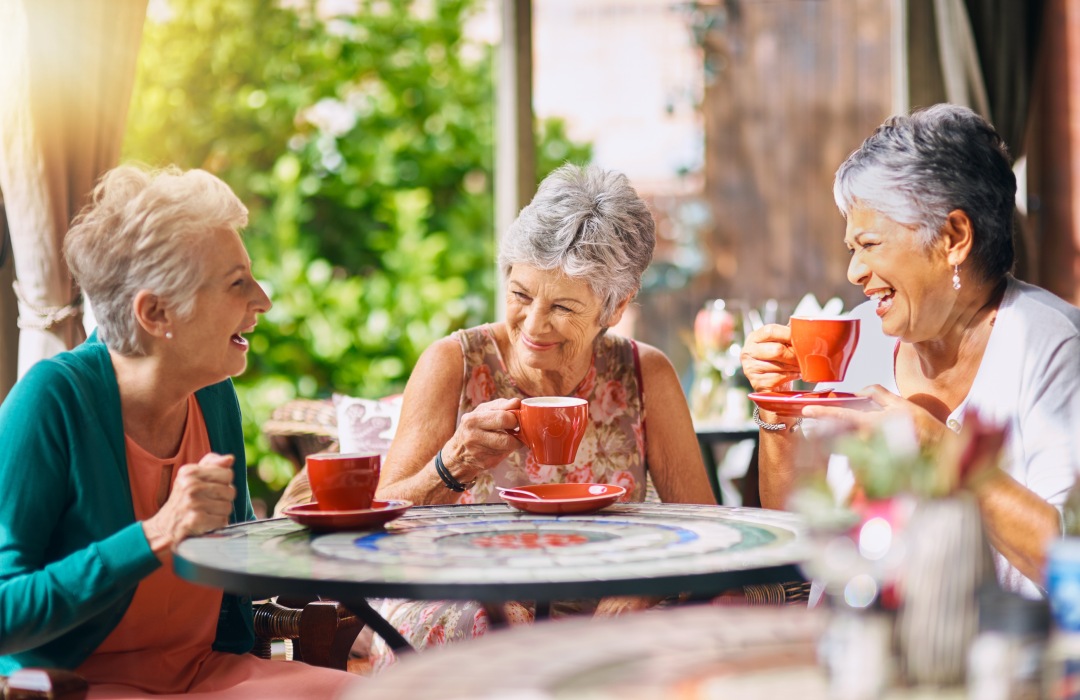 Independent Living Three ladies laughing and drinking coffee