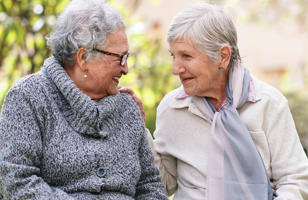 Senior Living Options Two women talking and smiling