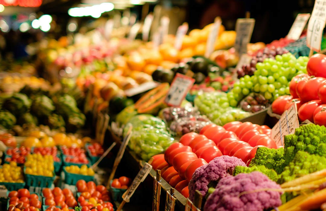 Fruit and Vegetables A bunch of fruit and vegetables on shelfs