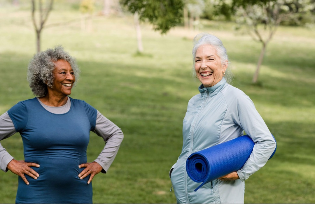 Yoga Two women about to do outdoor yoga