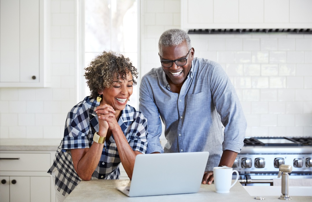 Home Safety Tips Couple reading laptop