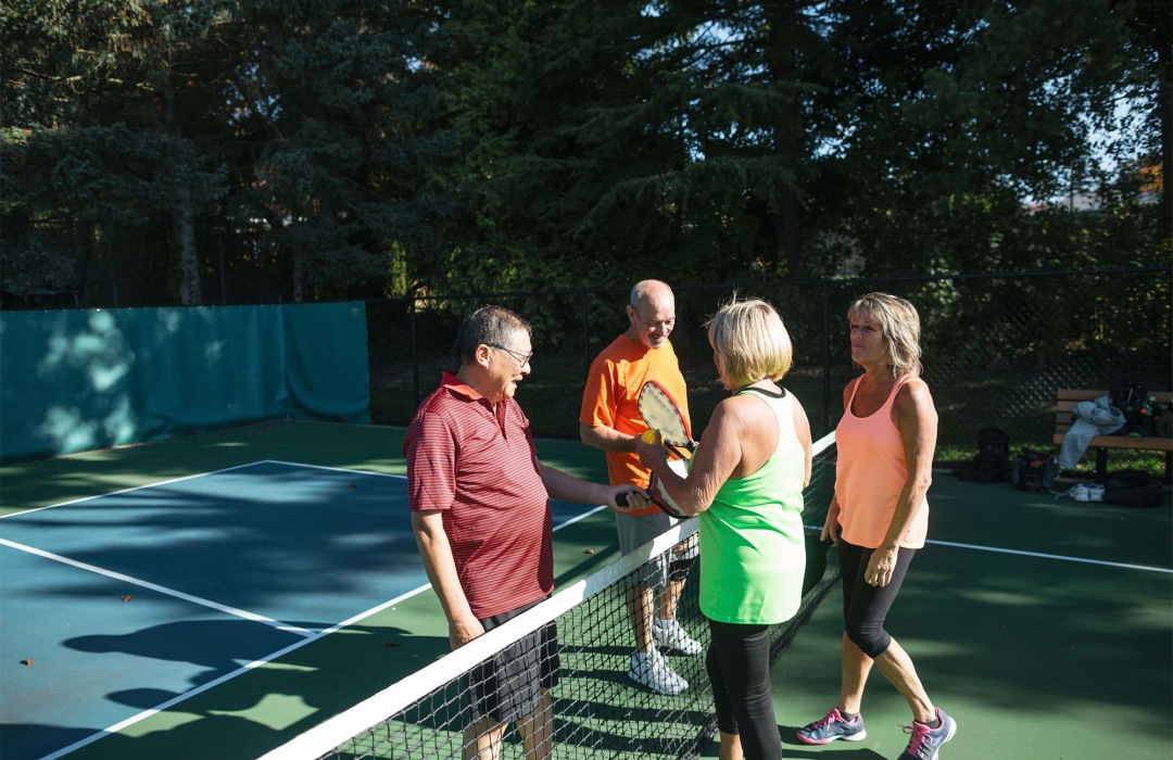 Group of people playing pickleball